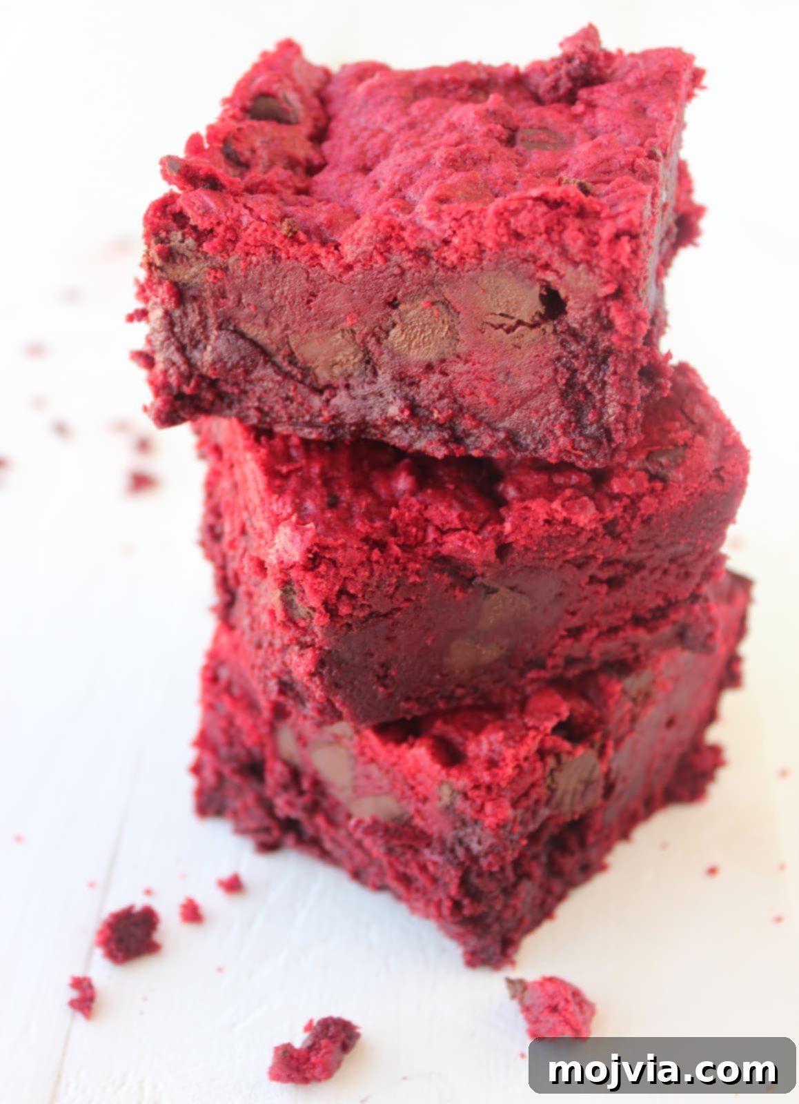 Ruby Red Brookie Bliss 10 Three perfectly baked Red Velvet Brookies stacked on top of each other, displaying their tempting layers.