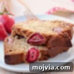 Slices of strawberry banana bread on top of each other