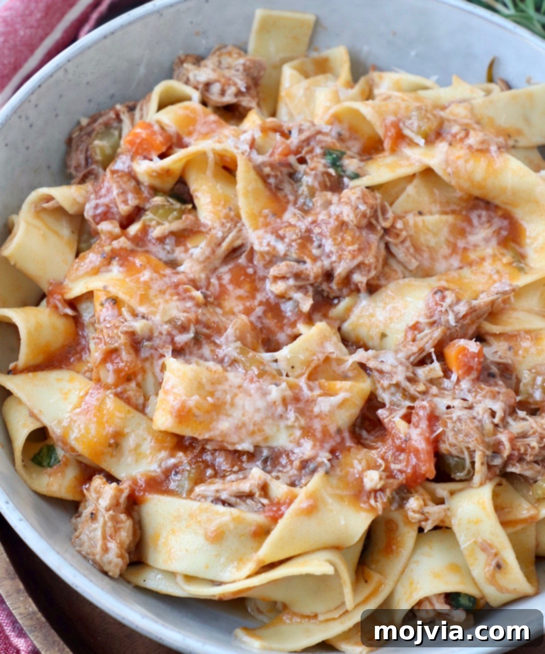Braised Pork Ragu 11 cooked pasta tossed with pork ragu sauce in a bowl