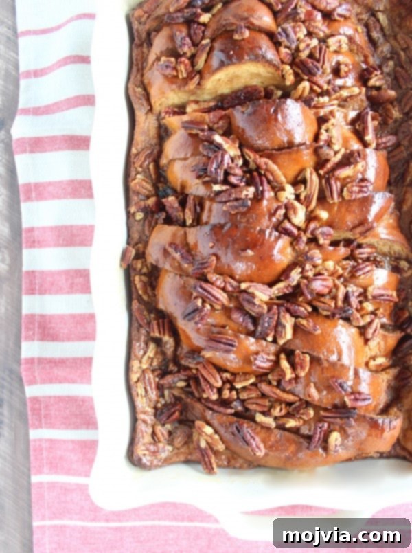Decadent Salted Caramel Praline French Toast 2 Golden brown Salted Caramel Praline French Toast in a white casserole dish, fresh from the oven.