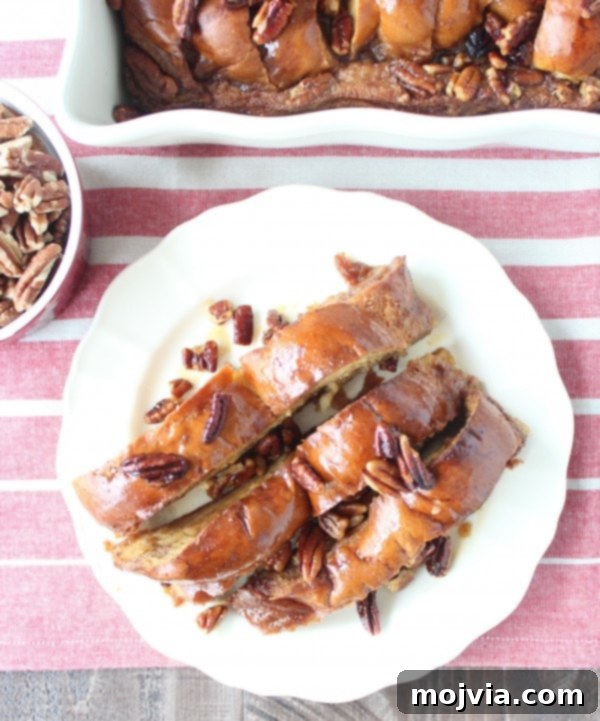 Decadent Salted Caramel Praline French Toast 11 Multiple slices of Salted Caramel Praline French Toast on a white plate, showcasing the luscious caramel and pecan topping, ready for a gourmet brunch.