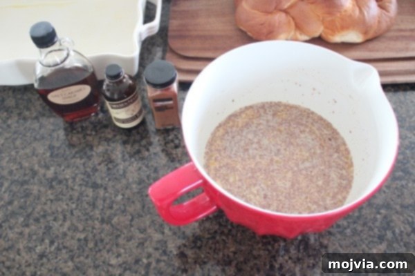 Decadent Salted Caramel Praline French Toast 4 A smooth mixture of milk, eggs, vanilla, salted caramel syrup, brown sugar, and cinnamon in a large mixing bowl, ready for soaking.
