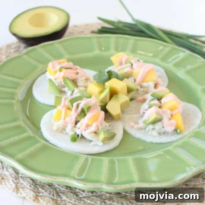 Crisp Jicama Crab Tacos 3 Close-up of a Jicama Crab Taco, showcasing fresh ingredients and vibrant colors of mango, avocado, and crab