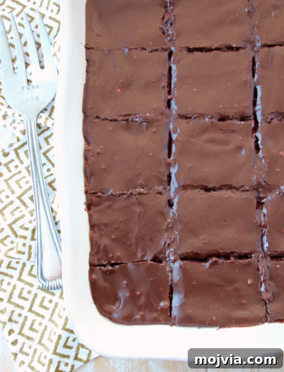 Chocolate brownies in baking dish, sliced into squares