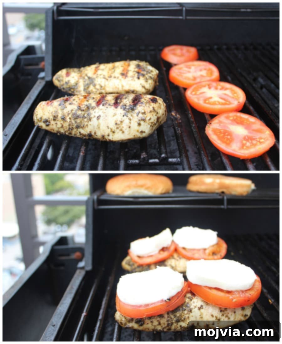 Pesto chicken and tomatoes on the grill with mozzarella slices