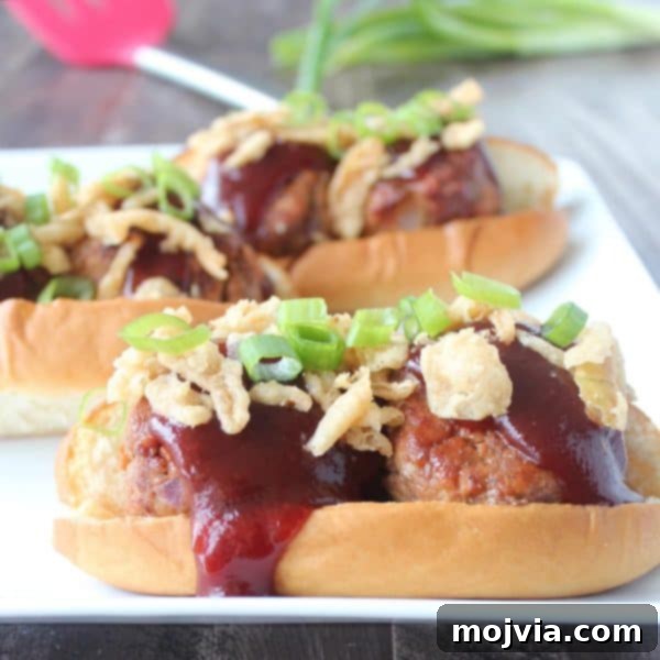 Smoky BBQ Meatball Hero 4 Three BBQ meatball subs on a wooden board