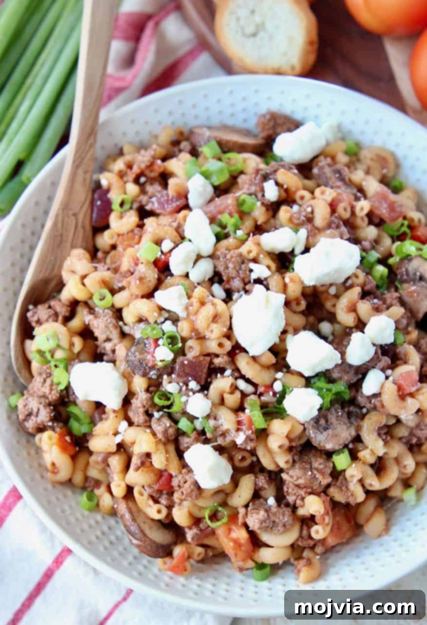 Mediterranean Lamb Pasta Skillet 3 Overhead image of ground lamb pasta topped with feta cheese crumbles