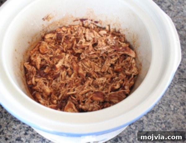 Smoky Sweet Chipotle Pulled Chicken Sliders 9 Shredded chicken in the slow cooker with juices