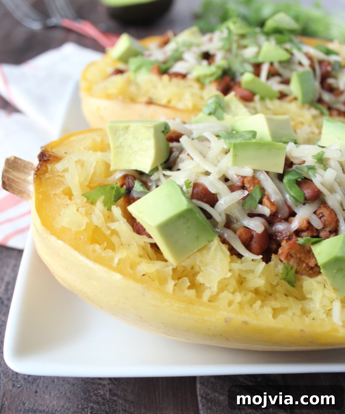 Turkey Chili Spaghetti Squash Bowls 2 Hearty Turkey Chili Stuffed into Roasted Spaghetti Squash Halves, topped with avocado and cilantro