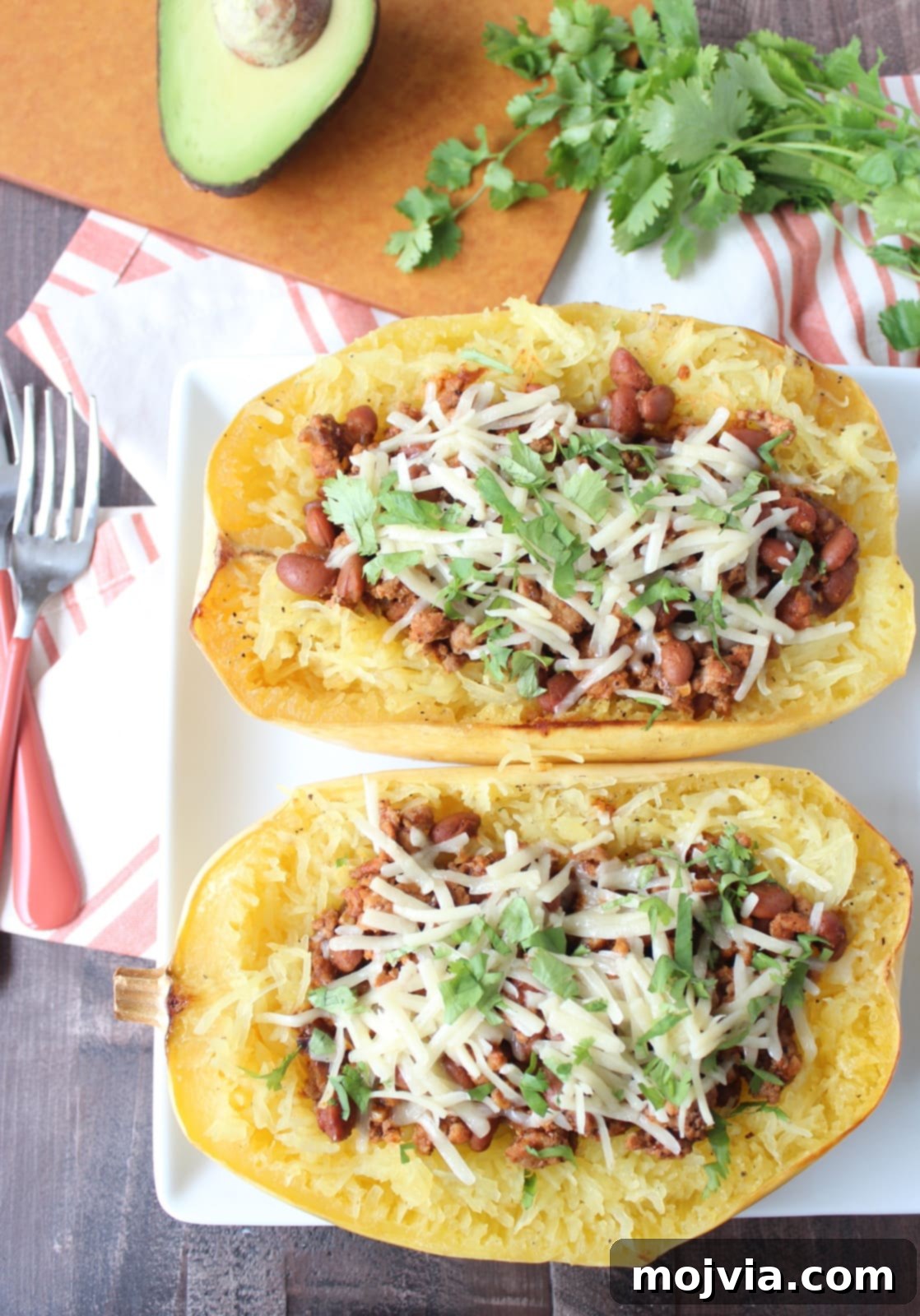 Turkey Chili Spaghetti Squash Bowls 7 Roasted spaghetti squash halves filled with savory turkey chili