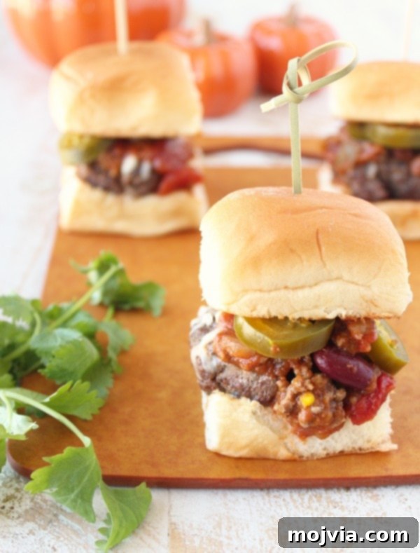 Spiced Pumpkin Chili Sliders 4 Pumpkin Chili Sliders ready to be served, showcasing the buns and toppings
