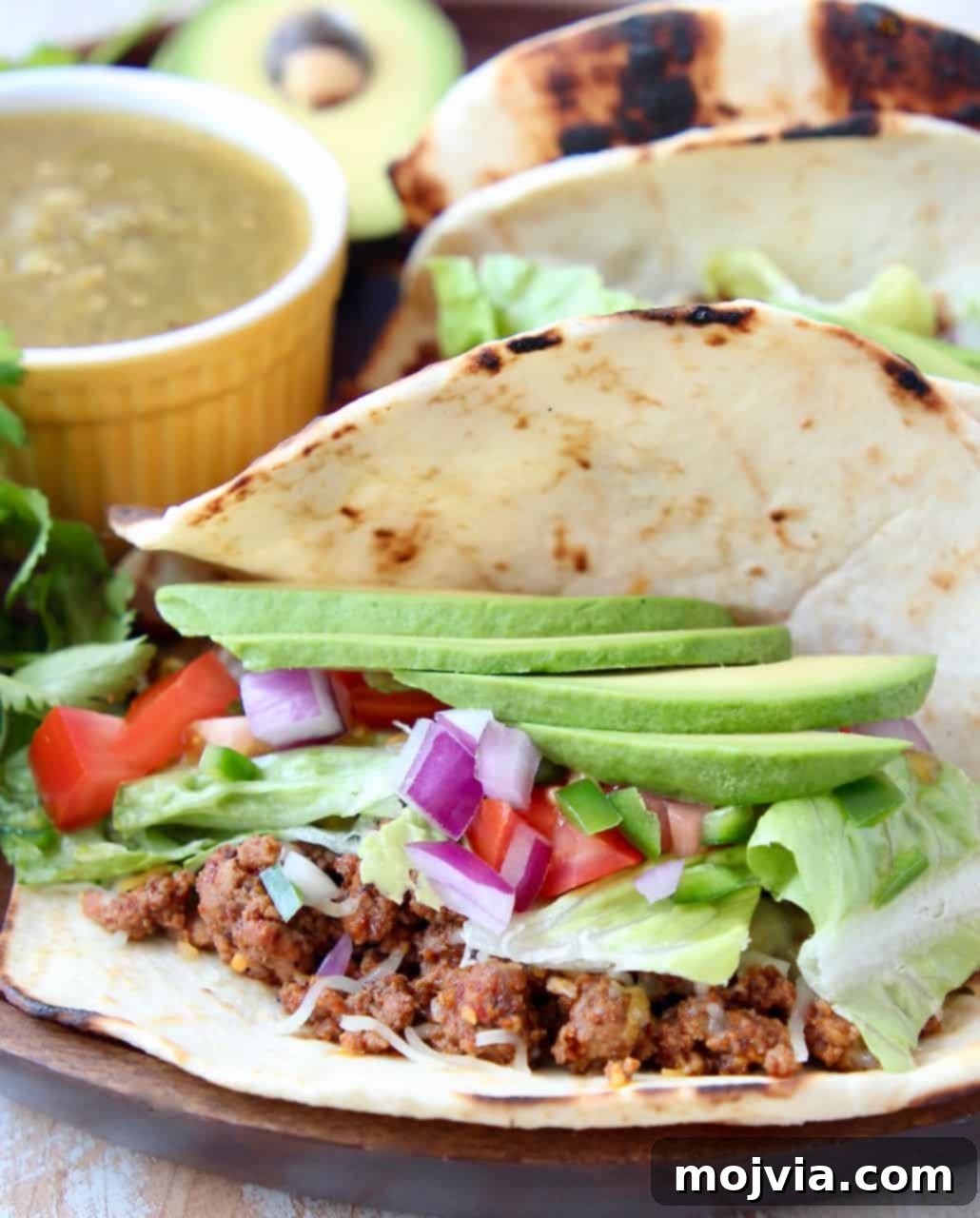 Trader Joe's Twist on Tacos 5 A single ground beef taco in a flour tortilla, beautifully topped with a slice of fresh avocado