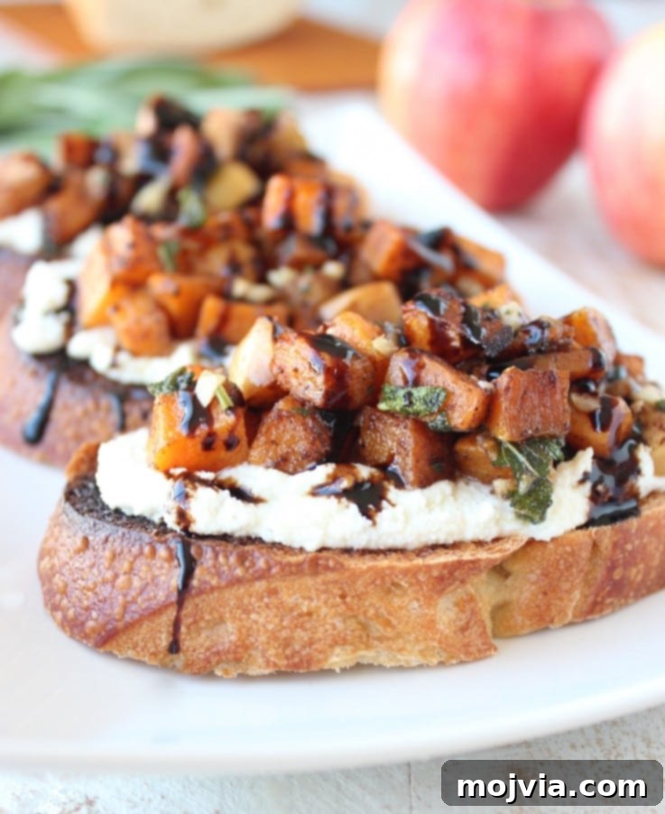 Caramelized Butternut Apple Crostini 2 roasted diced butternut squash on top of ricotta cheese on toasted bread