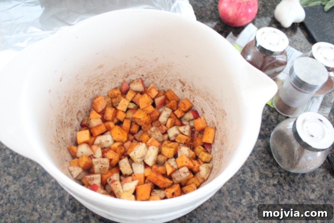 Caramelized Butternut Apple Crostini 4 seasoned diced butternut squash and apples in large bowl