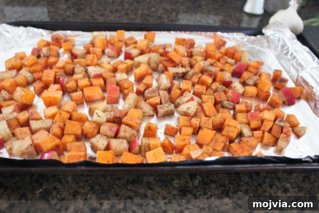 Caramelized Butternut Apple Crostini 5 seasoned diced butternut squash and apples on foil-lined baking sheet