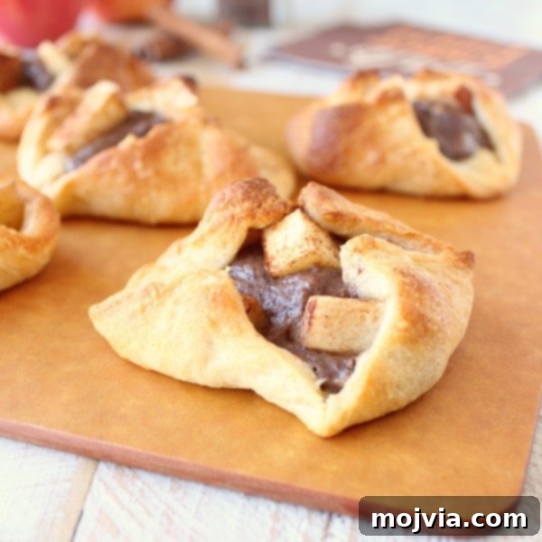 Creamy Apple Cinnamon Danish Delight 4 Freshly baked Cinnamon Apple Danish, golden brown and ready to serve