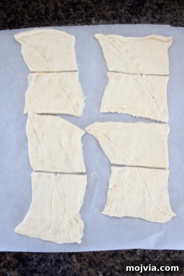Creamy Apple Cinnamon Danish Delight 7 Crescent roll dough unrolled and cut into squares