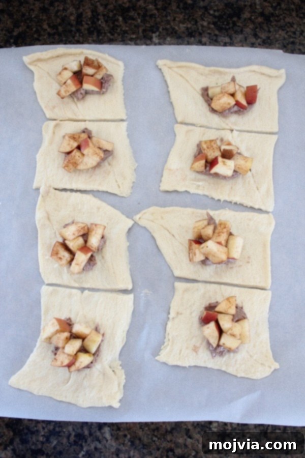 Creamy Apple Cinnamon Danish Delight 9 Diced cinnamon apples placed over cream cheese filling on crescent dough