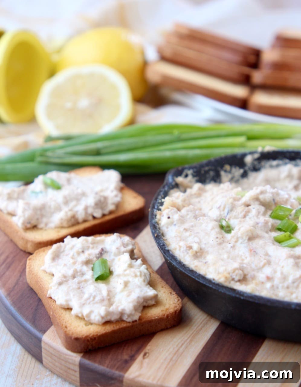 Baked Crab Dip 3 Crab dip spread generously on toasted brioche slices, ready to serve