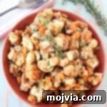 Let this delicious sweet potato stuffing recipe slow cook while preparing your Thanksgiving meal, leaving extra space in the oven & saving you time!