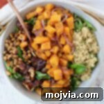 Golden Roasted Butternut Salad 10 butternut squash salad in a bowl with a fork