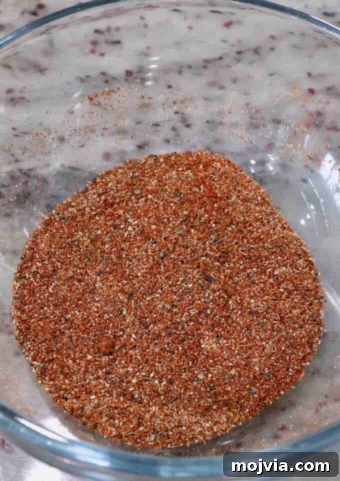 Sweet Heat Chipotle Chicken Tenders 6 A small glass bowl filled with the combined spices for seasoning the chicken.