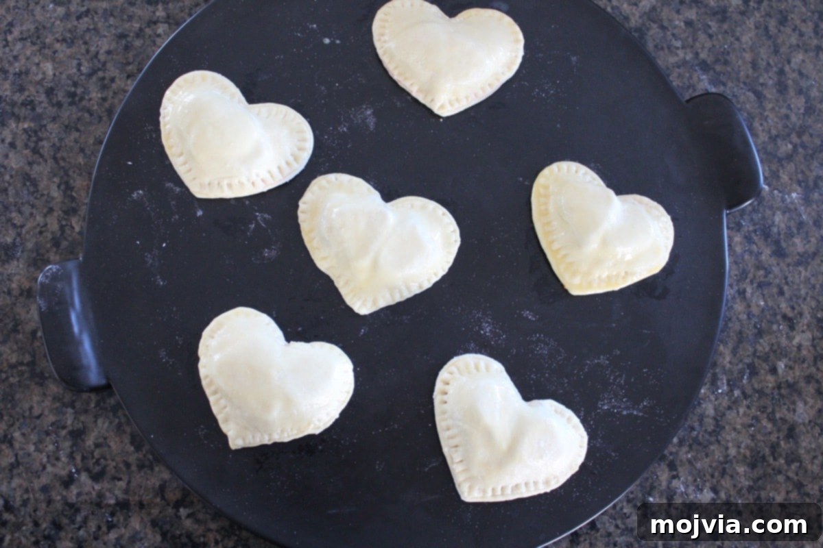 Strawberry Cheesecake Puff Pastry Hearts 12 Heart shaped strawberry cheesecake pies ready for the oven