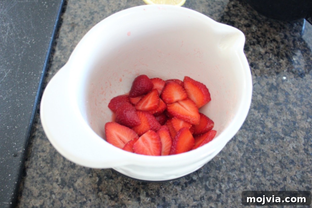 Strawberry Cheesecake Puff Pastry Hearts 6 Fresh strawberries being mixed with sugar and lemon juice