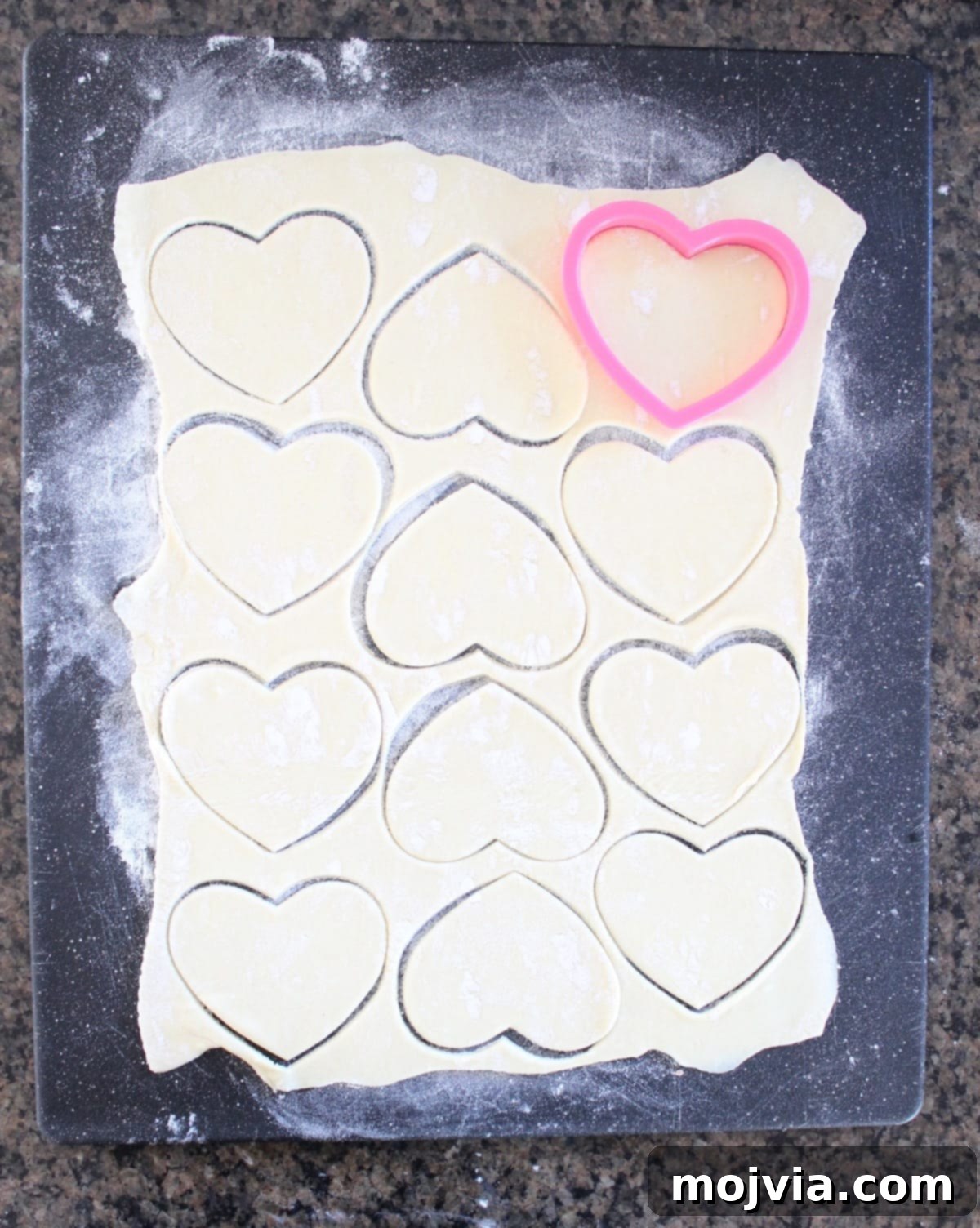Strawberry Cheesecake Puff Pastry Hearts 7 Heart shapes being cut from puff pastry dough