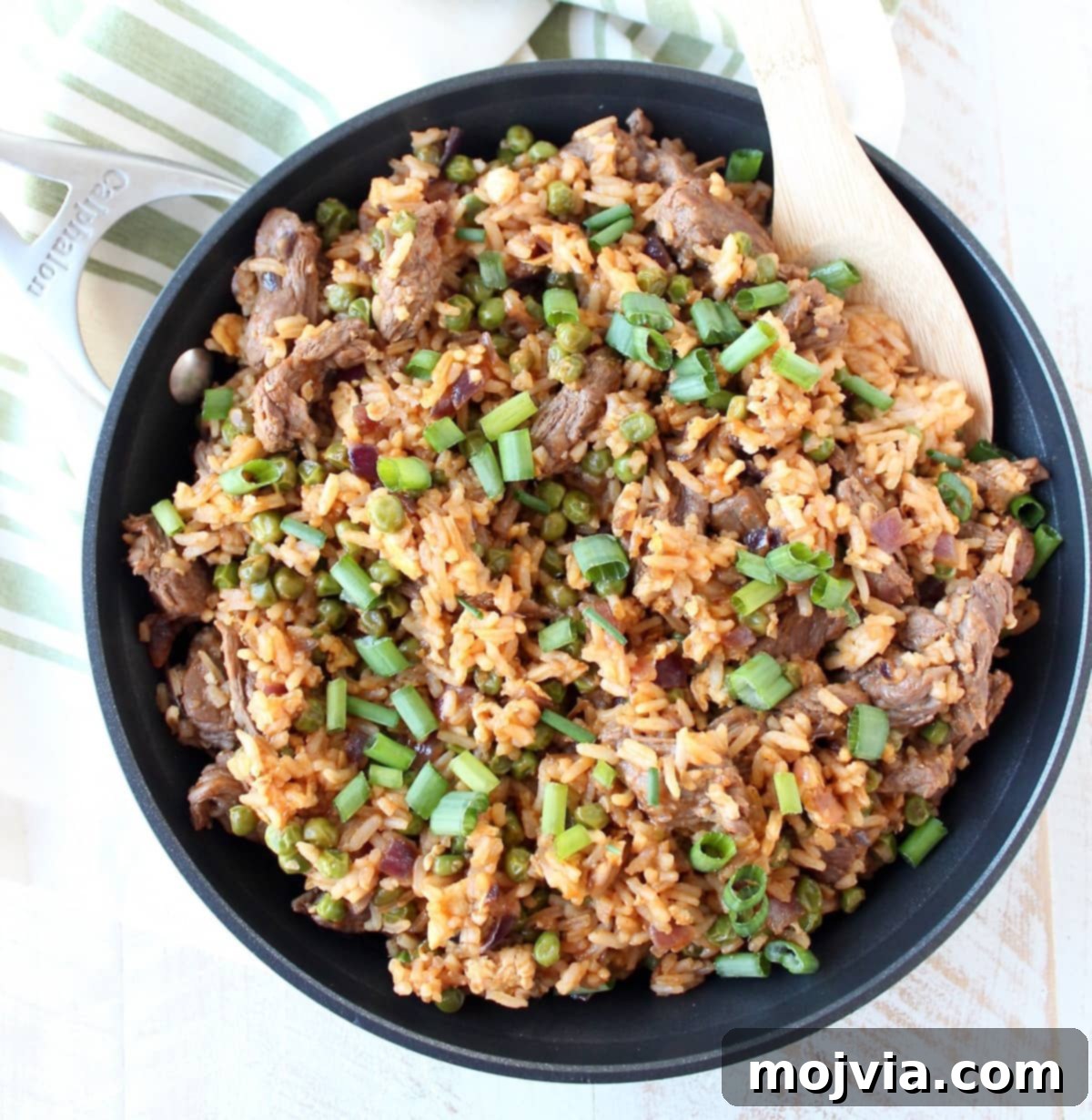 Spicy Sriracha Steak Fried Rice 6 Close-up of Sriracha Steak Fried Rice, garnished with green onions and ready to serve