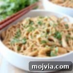 noodles in white bowl with chopsticks on the side