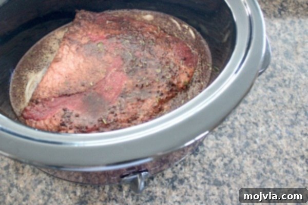 Liquids poured over brisket in slow cooker