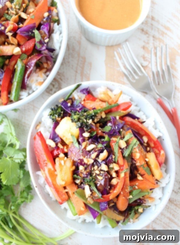 Vibrant Thai Peanut Pineapple Bowl 11 Thai Peanut Pineapple Veggie Rice Bowl in a bowl with chopsticks