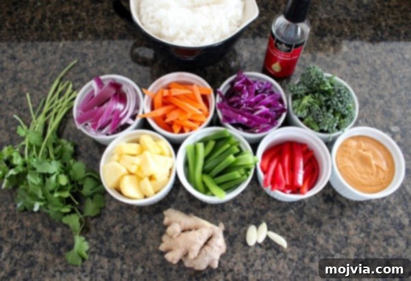 Vibrant Thai Peanut Pineapple Bowl 6 Fresh ingredients for Thai Peanut Pineapple Veggie Rice Bowl laid out on a table