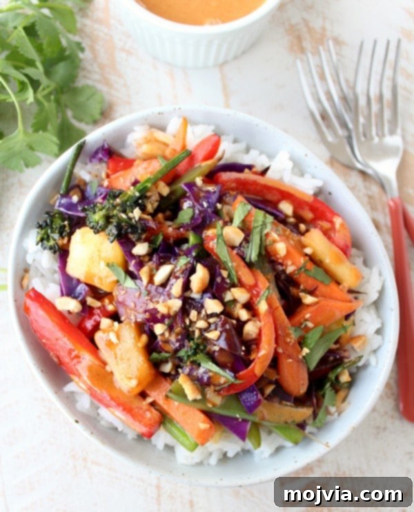 Vibrant Thai Peanut Pineapple Bowl 9 Finished Thai Peanut Pineapple Veggie Rice Bowl drizzled with sauce and toppings