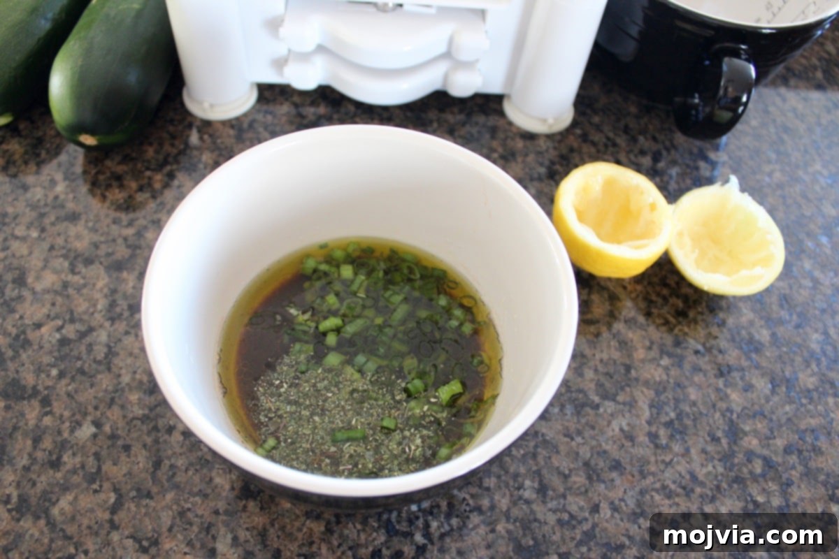 Greek balsamic salad dressing in a small bowl, whisked and ready