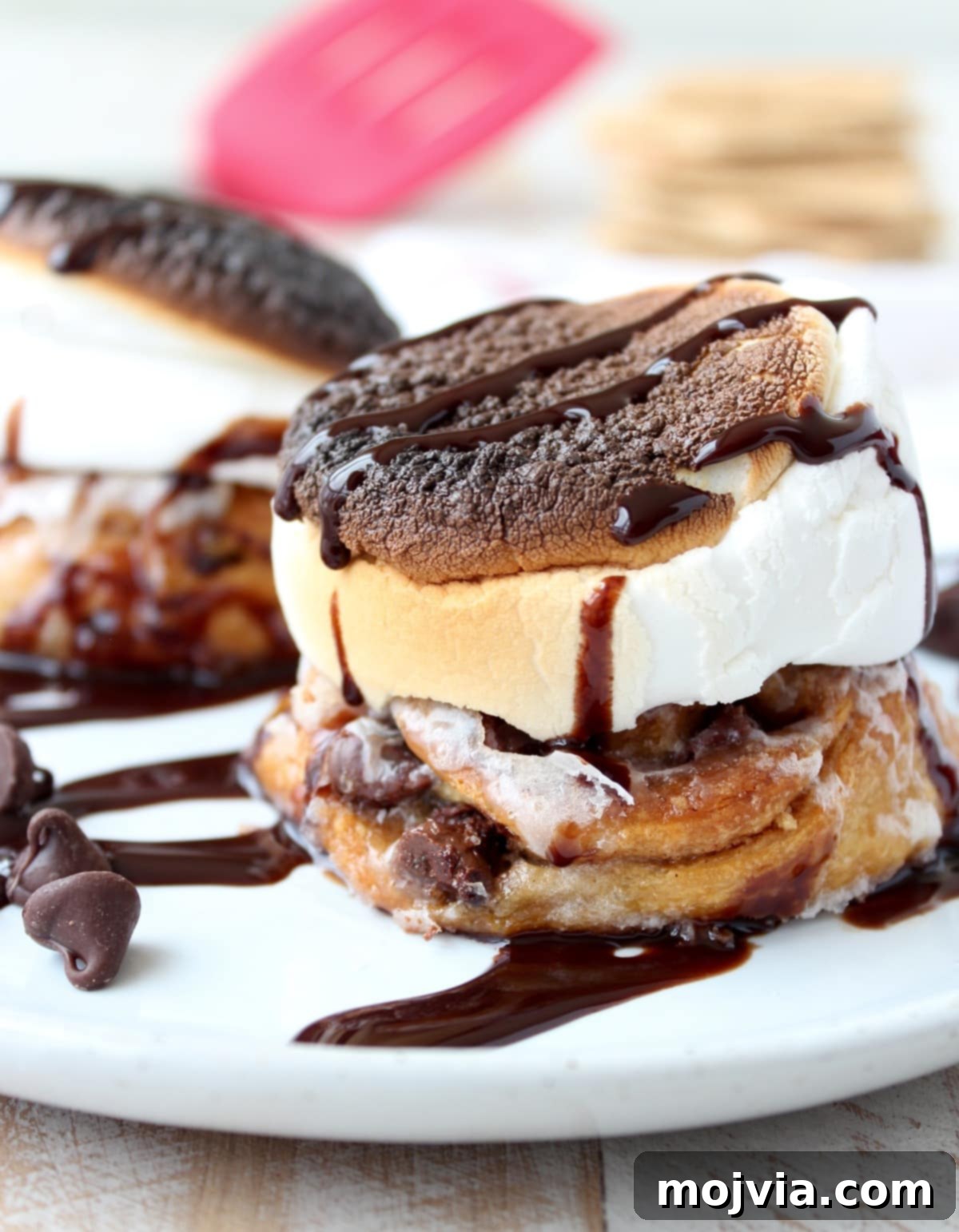Irresistible S'Mores Cinnamon Rolls fresh from the oven, topped with toasted marshmallows.
