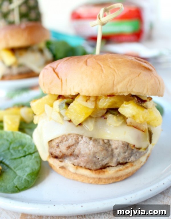 Luau Turkey Burgers 4 Close-up of Hawaiian Turkey Burgers with relish and melted cheese