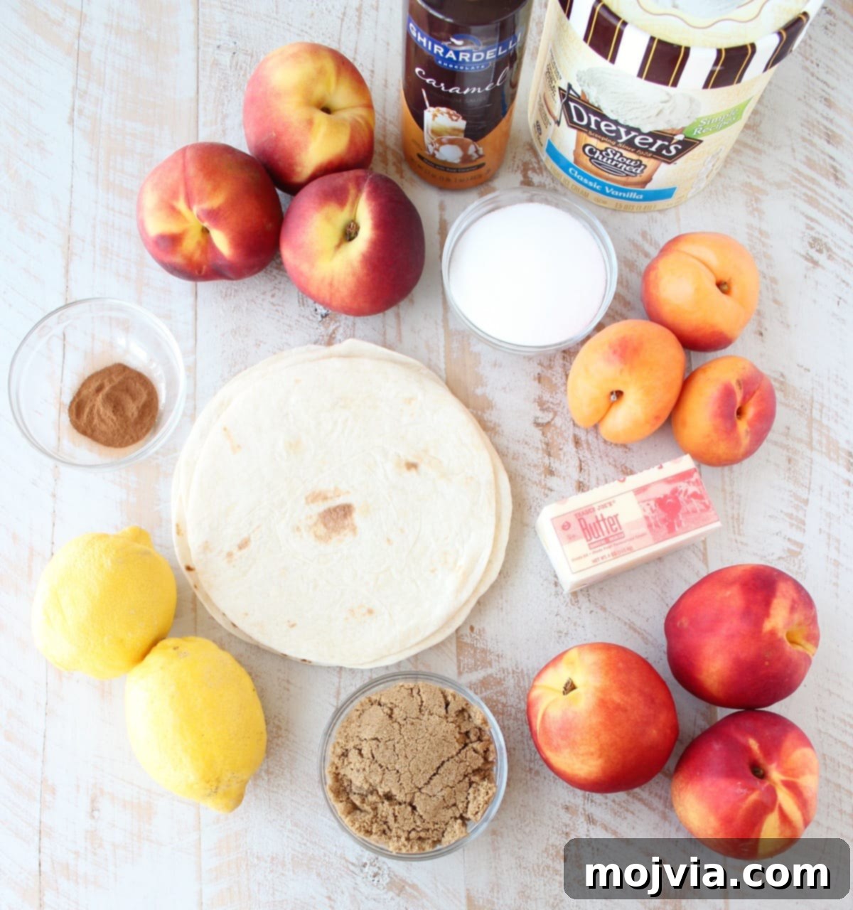 Effortless Fruit-Filled Dessert Shells 3 Crock Pot Dessert Fruit Taco Cups Ingredients on a white wood board