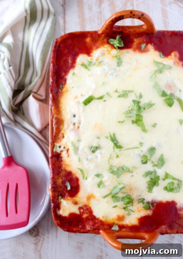Freshly baked Garlic Naan Lasagna, bubbling hot and golden brown from the oven