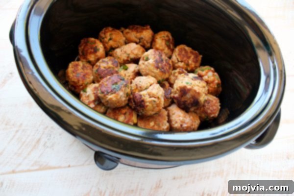 Thai Peanut Turkey Meatball Bliss 6 Seared turkey meatballs placed inside a slow cooker