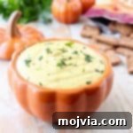 This creamy, sweet and spicy Jalapeno Pumpkin Dip recipe is an easy 5 minute appetizer that's vegetarian, gluten free and perfect for parties!