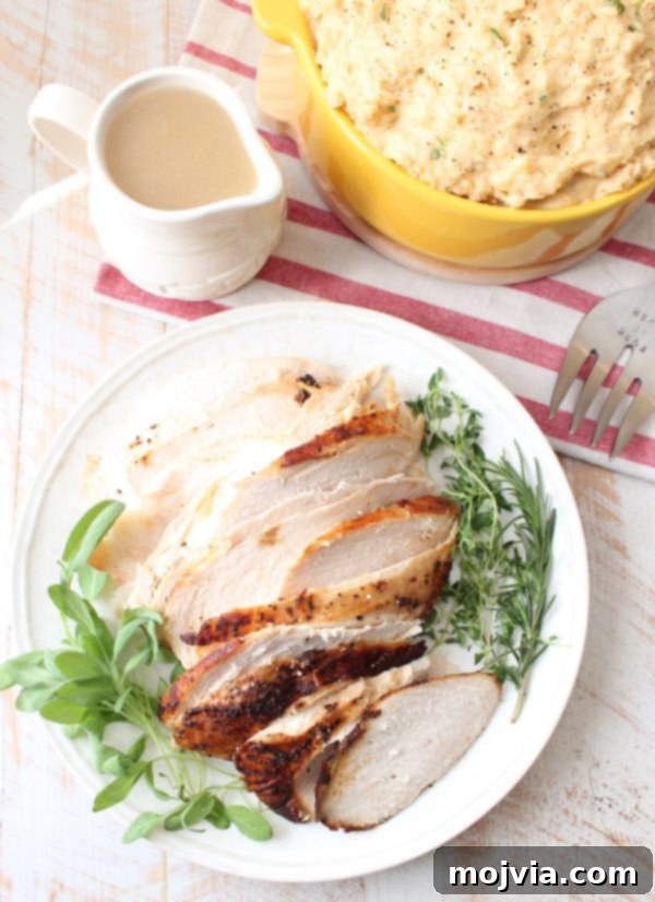 A perfectly roasted Jennie-O Cajun Turkey, golden brown and ready to carve, resting in a roasting pan.