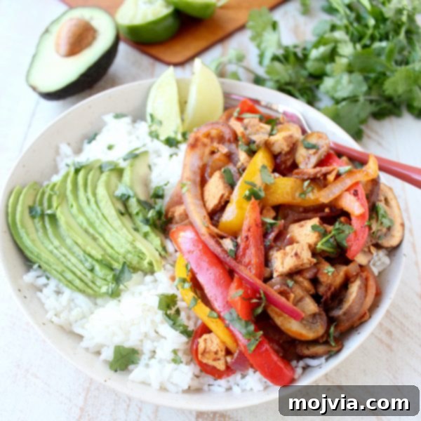Sizzling Turkey Fajita Rice Bowl 3 Close-up of a vibrant Turkey Fajita Rice Bowl, showcasing the seasoned turkey and colorful vegetables