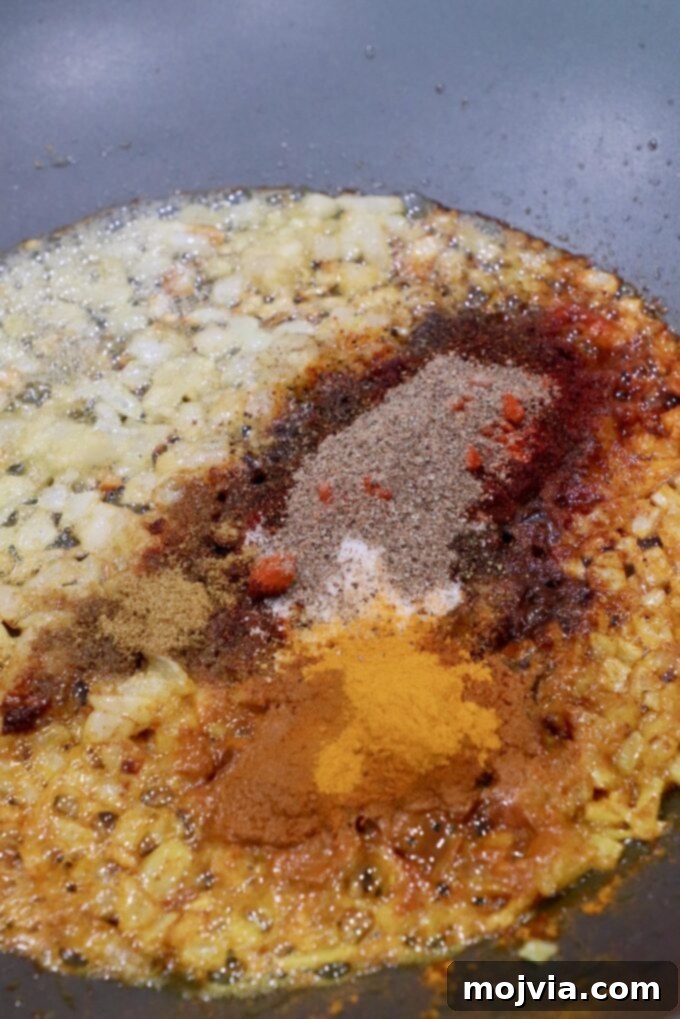 Velvet Butter Chicken 6 spices and diced onions in large skillet