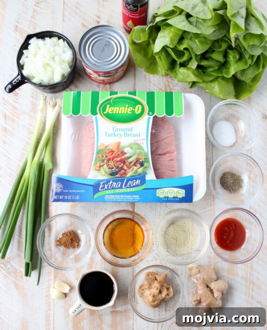 ingredients for turkey lettuce wraps on a white wood board
