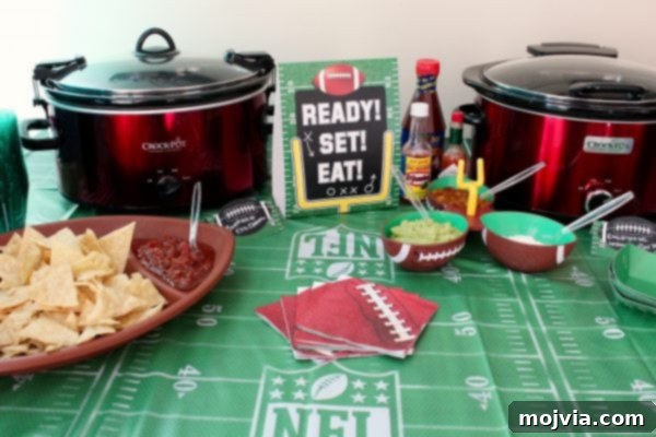 Taco Creation Station 3 Two slow cookers filled with delicious taco meats, ready for guests to customize their tacos. The meats are kept warm, ensuring a delightful experience throughout the party.