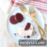These delicious no bake cheesecake bars with a Red Velvet Oreo crust are sweet, decadent and can be cut into heart shapes for a cute Valentine's Day Treat!