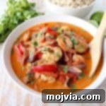 Shrimp & vegetables are cooked into a simple, delicious red curry sauce in this Red Curry Shrimp recipe, made in only 20 minutes for an easy weeknight meal!