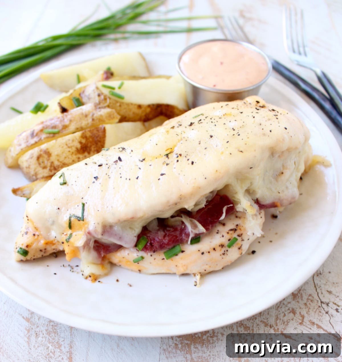 Reuben Chicken Roulade 2 Reuben Stuffed Chicken: Tender chicken breasts filled with corned beef, sauerkraut, Thousand Island dressing, and Swiss cheese, baked to perfection.
